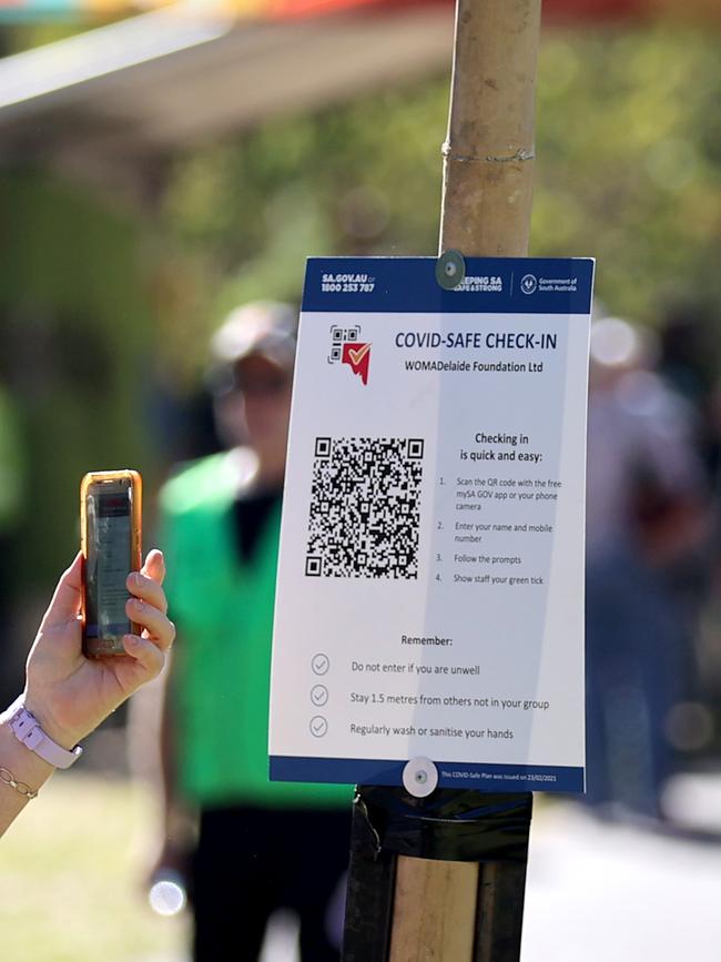 A patron uses a QR code to check in to a venue. Picture: Kelly Barnes/Getty Images