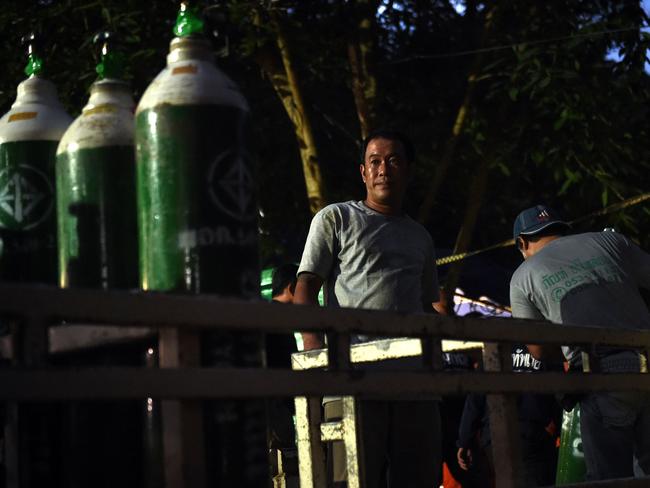 Thai soldiers and volunteers are transporting supplies and equipment to the boys in preparation for their terrifying escape attempt. Picture: AFP Photo / Lillian Suwanrumpha