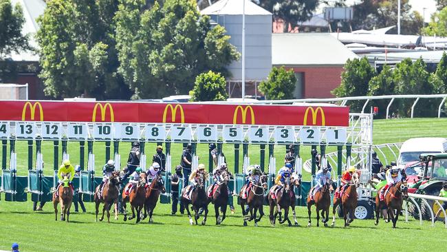 Horses jump from the barriers in race four with Sin To Win the widest runner.