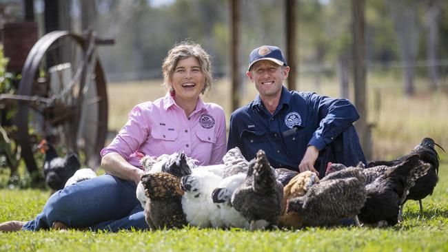 Kay and Dave Tommerup with some of the farm’s chickens.