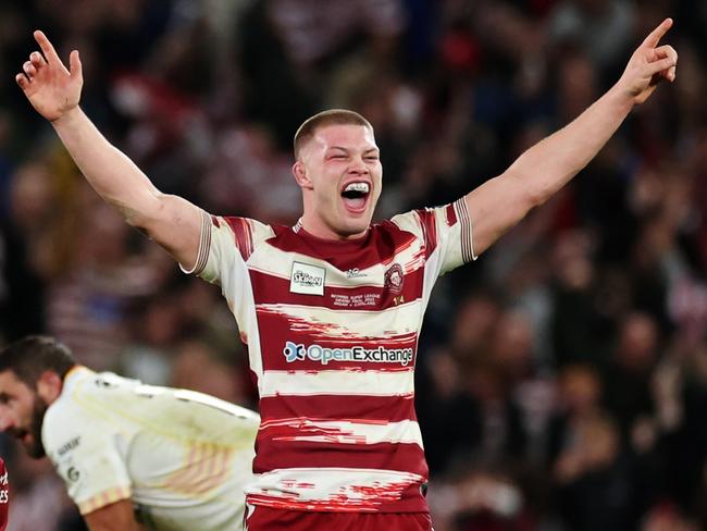 MANCHESTER, ENGLAND - OCTOBER 14: Morgan Smithies Wigan Warriors (R) celebrates with teammates after the team's victory during the Betfred Super League Final match between Wigan Warriors v Catalans Dragons at Old Trafford on October 14, 2023 in Manchester, England. (Photo by Jan Kruger/Getty Images)