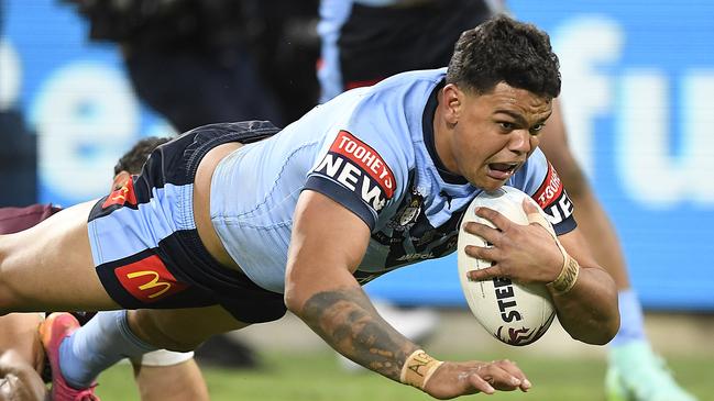 Latrell Mitchell crosses for a try during the 2021 State of Origin series.