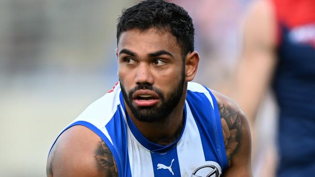 HOBART, AUSTRALIA - AUGUST 06: Tarryn Thomas of the Kangaroos runs the ball during the round 21 AFL match between North Melbourne Kangaroos and Melbourne Demons at Blundstone Arena, on August 06, 2023, in Hobart, Australia. (Photo by Steve Bell/Getty Images)