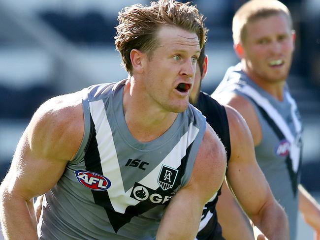 BRISBANE, AUSTRALIA - JULY 19: Tom Jonas of the Power looks to pass during the round 7 AFL match between the Carlton Blues and the Port Adelaide Power at The Gabba on July 19, 2020 in Brisbane, Australia. (Photo by Jono Searle/AFL Photos/via Getty Images)