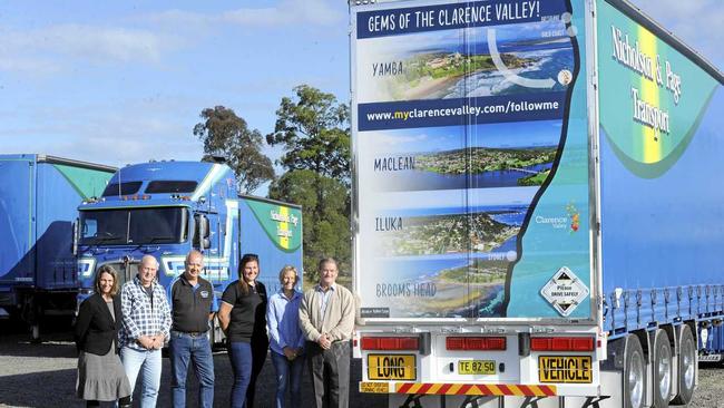 ON THE ROAD: Clarence Valley Council destination management officer Louise Gumb, Maclean Chamber president Peter Gordon, Nicholson & Page Transport's  Graeme Page, photographer Jessica Robertson, Iluka/Woombah Chamber president Sonia Deakin and CVC Mayor Jim Simmons with one of the Nicholson and Page Transport trucks with aerial photography to promote the region. Picture: Jarrard Potter