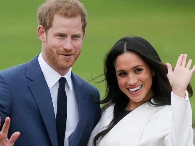 (FILES) In this file photo taken on November 27, 2017 Britain's Prince Harry and his fiancée US actress Meghan Markle pose for a photograph in the Sunken Garden at Kensington Palace in west London following the announcement of their engagement. - The Duke and Duchess of Sussex have told the UK's tabloid press they are ending all co-operation with them on April 20, 2020. (Photo by Daniel LEAL-OLIVAS / AFP)