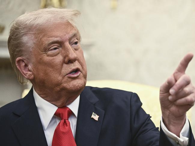 President Donald Trump speaks during a meeting with El Salvador's President Nayib Bukele in the Oval Office of the White House in Washington, Monday, April 14, 2025. (Pool via AP)