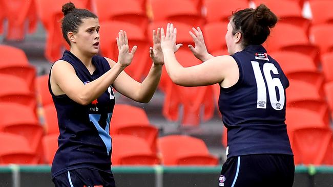 Nell Morris-Dalton celebrates a Vic Metro goal with Emily Harley.