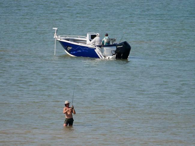 Fisherman braves croc-inhabited waters hoping for a bite