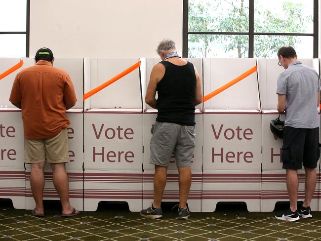 BRISBANE, AUSTRALIA - MARCH 28: Voters are seen keeping a distance at Brisbane City Hall on March 28, 2020 in Brisbane, Australia. Queensland local government elections and two state by-elections  are going ahead on Saturday, despite concerns about people gathering at polling stations amid the ongoing COVID-19 pandemic. Authorities will be imposing social distancing measures, and with a record number of pre-poll and postal votes, believe the risk of spreading the coronavirus is low compared to other day-to-day activities like visiting the supermarket. The Federal Government has introduced strict measures in response to the COVID-19 outbreak, requiring Australians to practise social distancing when outside their homes, banning large indoor and outdoor gatherings and limiting international and domestic travel to essential, work-related or compassionate only. All libraries, museums, galleries, beauty salons, tattoo parlours, shopping centre food courts, auctions, open houses, amusement parks, arcades, indoor and outdoor play centres, swimming pools are closed and indoor exercise activities are now banned along with bars, pubs, casinos and nightclubs. Restaurants and cafes are restricted to providing takeaway only. Weddings are now restricted to five people including the couple while funerals are limited to 10 mourners. All Australians are now expected to stay at home except for essential outings such as work, grocery shopping and medical appointments. Exercising outdoors alone is still permitted. Australia is approaching 3000 confirmed cases of COVID-19 while the death toll now stands at 13. (Photo by Jono Searle/Getty Images)