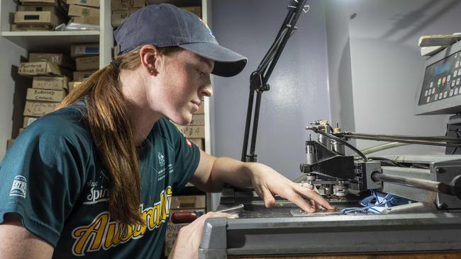 Australian softballer Rachel Lack at her family factory which makes trophies and medals. Pic: Matthew Vasilescu.