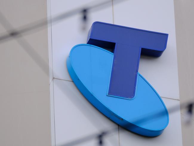 MELBOURNE, AUSTRALIA - NewsWire Photos OCTOBER 4, 2022. Generic photo people walking past the Telstra logo in Melbourne..Picture: NCA NewsWire / Luis Enrique Ascui