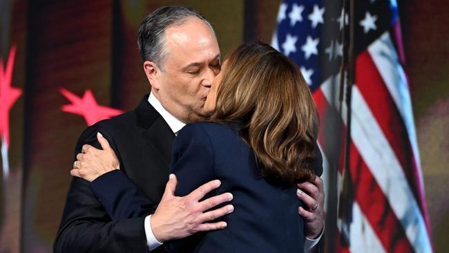 US second gentleman Douglas Emhoff kisses US Vice-President and 2024 Democratic presidential candidate Kamala Harris after speaking on the last day of the Democratic National Convention on August 22, 2024. Picture: AFP