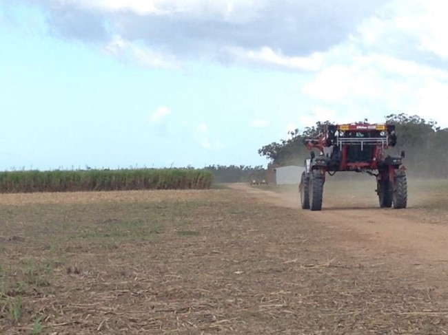 NEW TECHNOLOGY: An automated machine, used to spray herbicide, shown to Tim Nicholls, Deb Frecklington and Stephen Bennett.