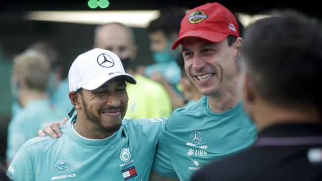 Toto Wolff (right) says it’s only a matter of time before Mercedes and Lewis Hamilton (left) agree to a contract extension. (Photo by Luca Bruno / POOL / AFP)