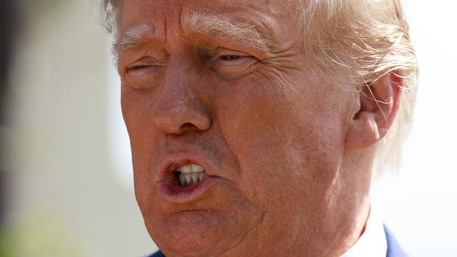 PALM BEACH, FLORIDA - NOVEMBER 08: Former President Donald Trump speaks to the media after voting at a polling station setup in the Morton and Barbara Mandel Recreation Center on November 08, 2022 in Palm Beach, Florida. After months of candidates campaigning, Americans are voting in the midterm elections to decide close races across the nation.   Joe Raedle/Getty Images/AFP