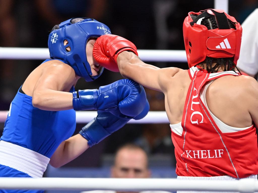 The fight between Algeria's Imane Khelif (red) and Angela Carini of Italy (blue) that sparked global outrage. Picture: Fabio Bozzani/Anadolu via Getty Images