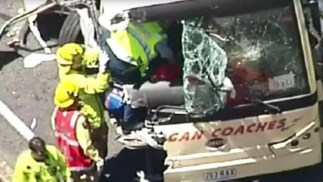 Scenes from the fatal crash at Yarrabilba which claimed the life of bus driver Peter Bohlsen.