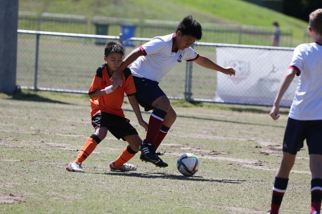 The Premier Invitational football tournament on the Gold Coast. TSS v Brisbane Roar under-13s in action. Picture: Mike Batterham.