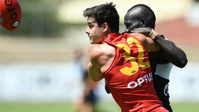 Aliir Aliir battles Darcy Fogarty for the ball. Picture: Getty Images