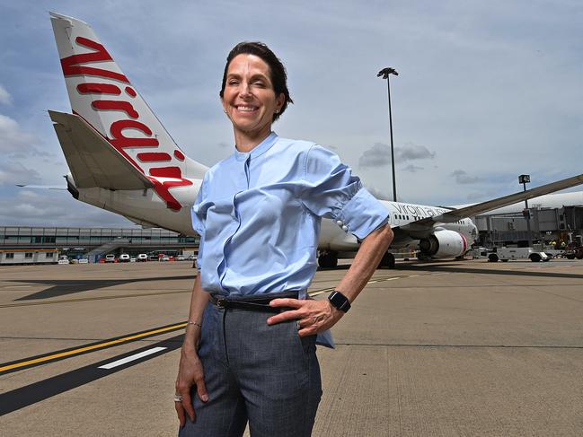 18/11/2020: Virgin CEO Jayne Hrdlicka, on a windy day with a Virgin aircraft airside at Brisbane Airport on her  first day as CEO at Virgin Australia, Brisbane Domestic Airport. Pic Lyndon Mechielsen