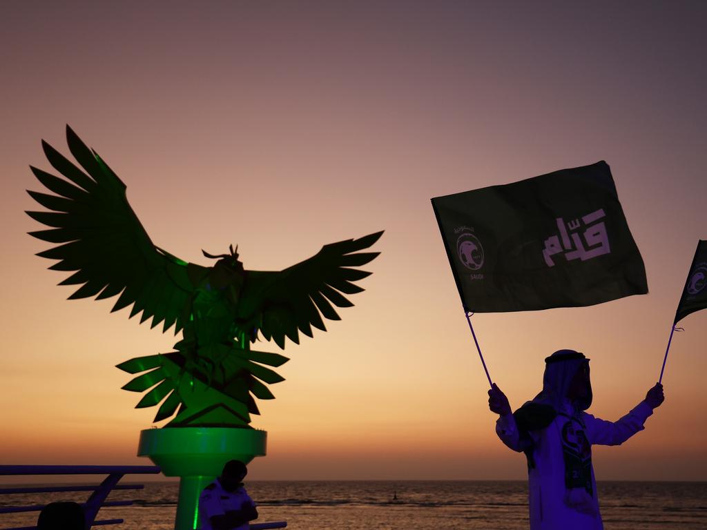 A fan waves a flag after Saudi Arabia was announced as host of the 2034 FIFA World Cup. Picture: Mahmoud Khaled/Getty Images for Saudi Arabian Football Federation