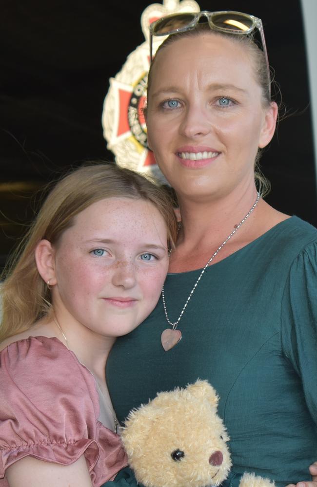 Madison Jennings with her mother Tinneile embracing after Madison accepted her certificate of appreciation at Mackay South Ambulance station after rescuing her cousin from drowning. Picture: Lillian Watkins