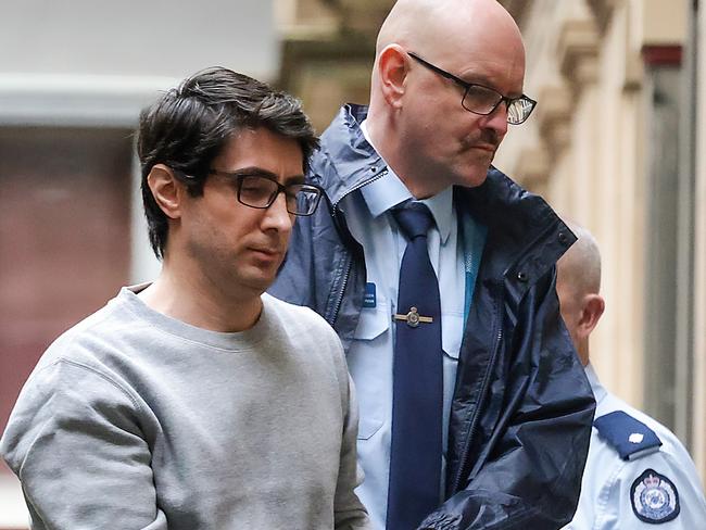 MELBOURNE, AUSTRALIA - NCA NewsWire Photos JULY 24, 2023 : Luay Sako is lead into the Supreme Court for the start of the dayÃs proceedings. Picture: NCA NewsWire / Ian Currie