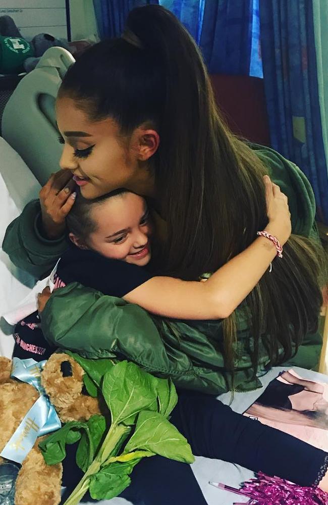Ariana Grande visits with eight-year-old Lily Harrison a victim of the Manchester Arena bombing. Picture: Lauren Thorpe