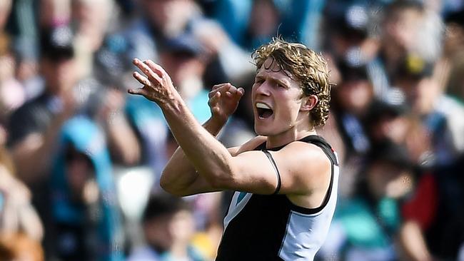 ADELAIDE, AUSTRALIA - AUGUST 27: Xavier Duursma of Port Adelaide celebrates a goal archer style during the round 24 AFL match between Port Adelaide Power and Richmond Tigers at Adelaide Oval, on August 27, 2023, in Adelaide, Australia. (Photo by Mark Brake/Getty Images)