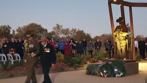 Anzac Day Alice Springs 2021 at the Cemetary Gardens War Memorial. Sydney Kinsman and Kathryn Campbell Magjen AO CSC lay a wreath on behalf of the Australian Defence Force.