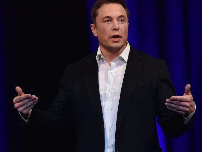 (FILES) File photo dated September 29, 2017 shows billionaire entrepreneur and founder of SpaceX Elon Musk speaking at the 68th International Astronautical Congress 2017 in Adelaide.  The world's biggest battery was officially launched in Australia on December 1, 2017, with the Elon Musk-driven project powered up early to meet peak demand amid a bout of hot weather, officials said. / AFP PHOTO / PETER PARKS