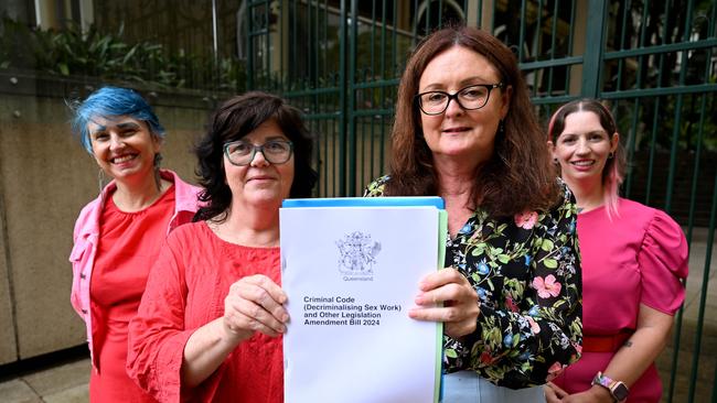 (L to R) Dr Elena Jeffreys and Janelle Fawkes from the Scarlet Alliance, QCU General Secretary Jacqueline King and Lulu Holiday from Respect Inc pose with the Sex Work Decriminalisation bill after it was introduced to state parliament last month. Picture: Dan Peled / NCA NewsWire