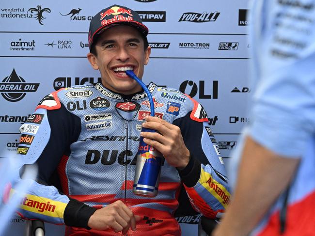 Gresini Racing MotoGP's  Spanish rider Marc Marquez relaxes in the garage as rain cancels the first practice session of the Australian MotoGP on Phillip Island on October 18, 2024. (Photo by Paul CROCK / AFP)