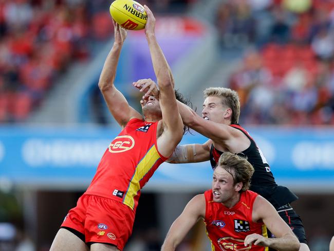 Ned Moyle marks against Essendon. Picture: Russell Freeman/AFL Photos via Getty Images