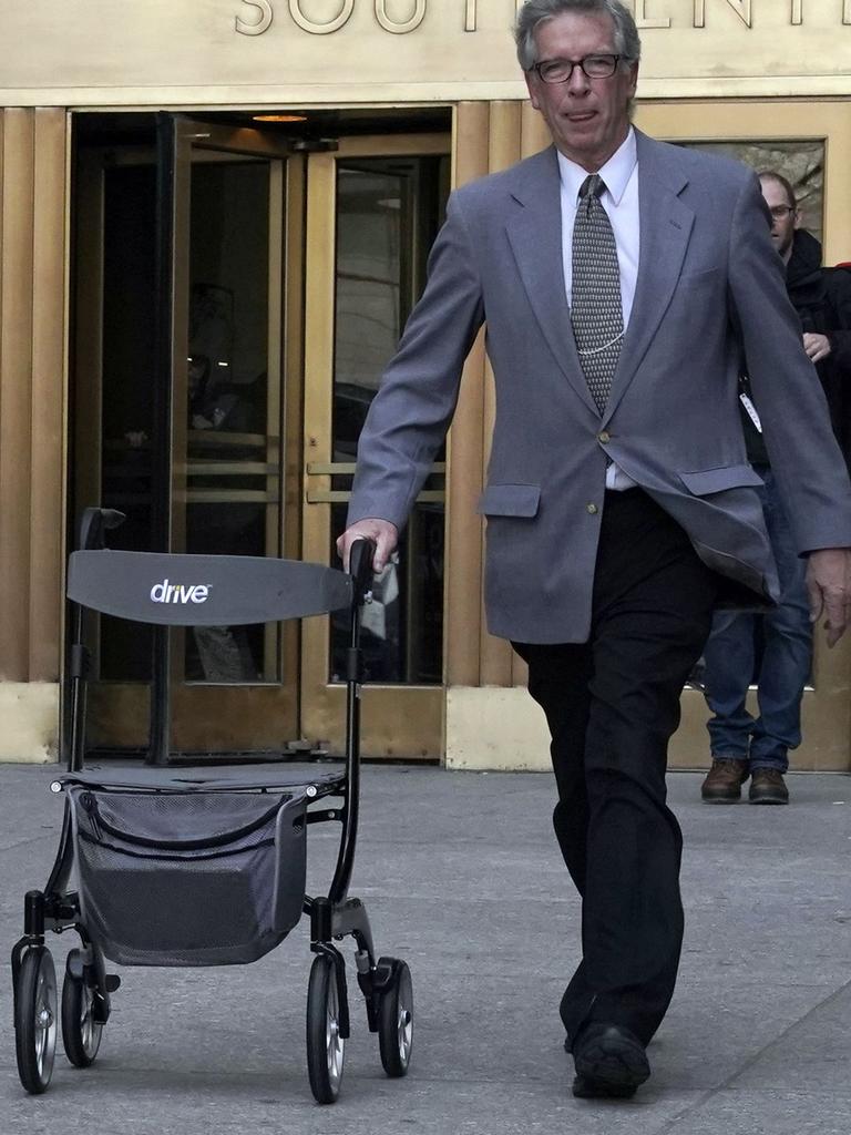 A man carried out the walker used by Weinstein after he was convicted. Picture: Timothy A. Clary/AFP