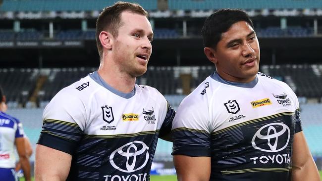 SYDNEY, AUSTRALIA - MARCH 19: Michael Morgan of the Cowboys and Jason Taumalolo of the Cowboys leave the field after winning the round 2 NRL match between the Canterbury Bulldogs and the North Queensland Cowboys at ANZ Stadium on March 19, 2020 in Sydney, Australia. Due to the COVID-19 virus outbreak, the fixture is the first top-level Sydney rugby league match played in 112 years where fans are locked out of the ground. This is due to a NSW Public Health Order prohibiting outdoor events with more than 500 people. (Photo by Cameron Spencer/Getty Images)