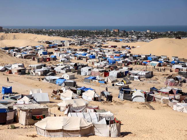 Tents sheltering people displaced by conflict with the Mediterranean sea in the background in the Mawasi area of Khan Yunis in the southern Gaza Strip. Picture: AFP