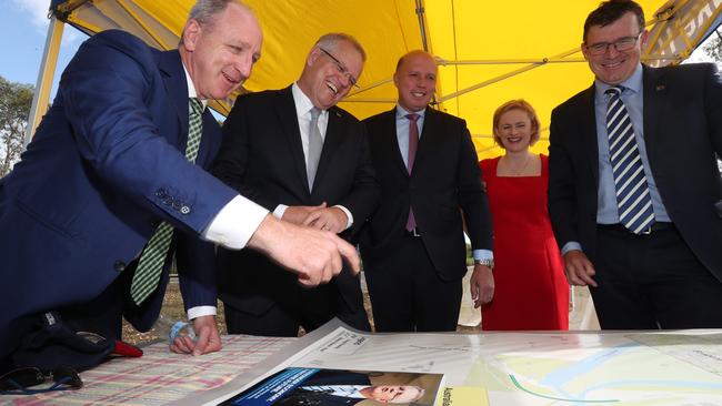 Looking over maps showing road upgrades for Bracken Ridge are Member for Petrie Luke Howarth, Prime Minister Scott Morrison, Member for Dickson Peter Dutton, Senator Amanda Stoker and Federal Minister for Cities, Urban Infrastructure and Population Alan Tudge. Picture: Annette Dew