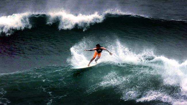 High Winds due to Cyclone Beni bring huge surfing conditions to the Gold Coast. Surfer in action at Burleigh Heads. Picture: Adam Ward