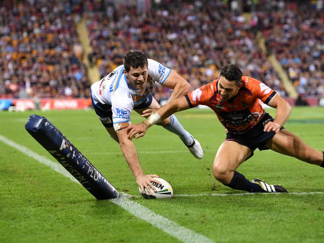 Storm player Billy Slater fails to stop Titans player Anthony Don scoring a try during the Round 10 NRL match between the Melbourne Storm and the Gold Coast Titans at Suncorp Stadium in Brisbane, Saturday, May 13, 2017. Picture: AAP Image/Dave Hunt.