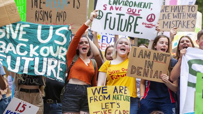 Sudents hold a Climate march at Martin Place near parliament house. 1000Õs of students walked out of school to demand politicians stop dangerous climate change & AdaniÕs coal mine. Pic Jenny Evans