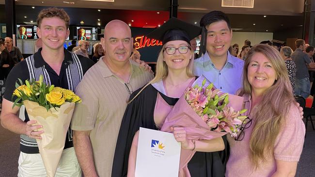 UniSC graduates celebrate at the Brolga Theatre in Maryborough, Qld.