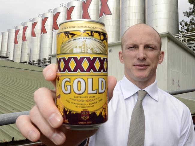 Queensland Rugby League legend Darren Lockyer poses with a can of a special edition XXXX beer to commemorate eight State of Origin series wins in a row by the Maroons. Picture: AAP Image/Dan Peled