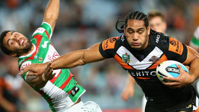 Marty Taupau sends Alex Johnston flying.