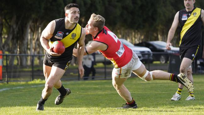 SFNL: South Mornington’s Jordan Waite sneaks past Mitchell Lambert of Hallam. Picture: Valeriu Campan