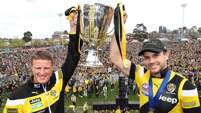 Richmond coach Damien Hardwick (left) and captain Trent Cotchin hold the AFL premiership trophy aloft during their celebrations in 2017. Picture: AAP