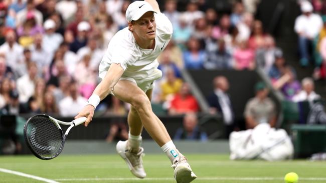 Jannik Sinner of Italy stretches to play a forehand against Daniil Medvedev in the Gentlemen's Singles Quarter Final match during day nine of The Championships Wimbledon 2024. Picture: Getty Images