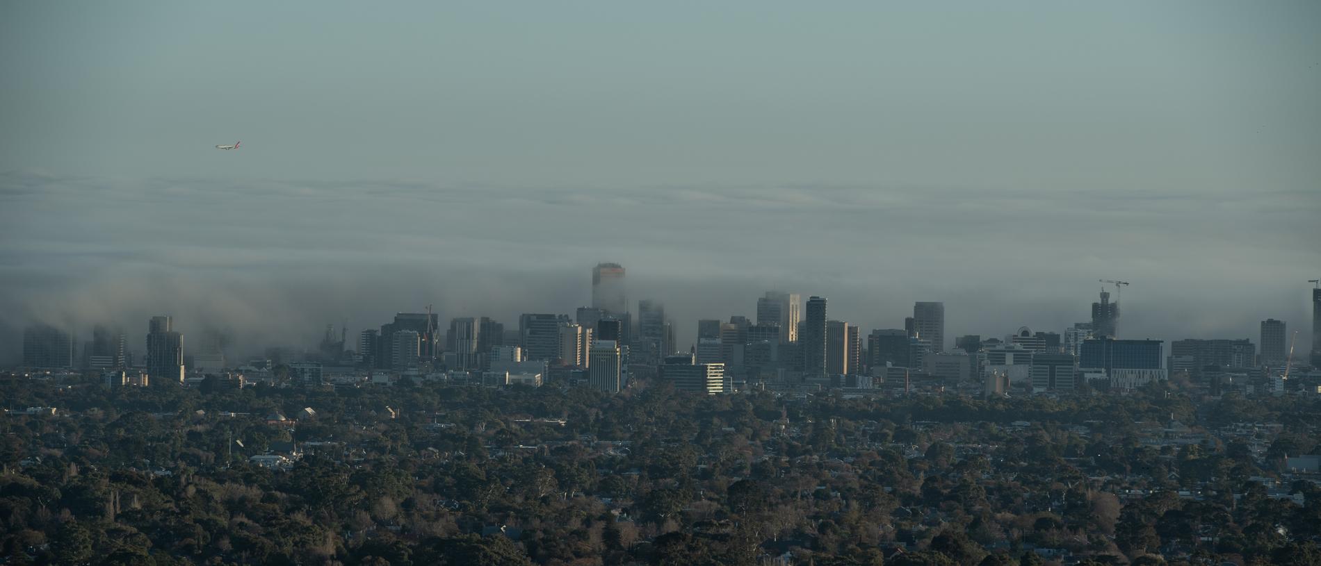 Fog drifts over the Adelaide CBD: Picture: Brad Fleet