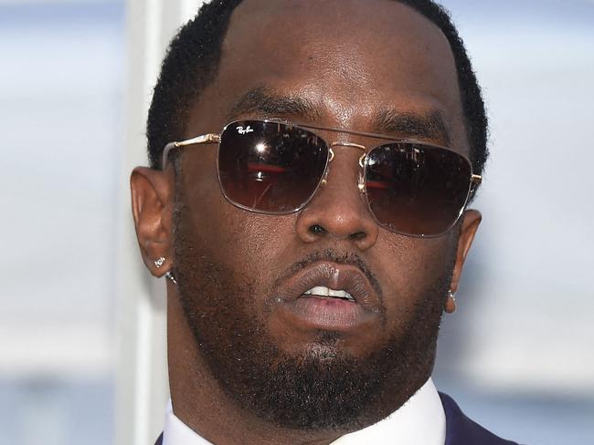 (FILES) Sean "Diddy" Combs attends the star ceremony for Mary J. Blige, on the Hollywood Walk of Fame, January 11, 2018 in Hollywood, California. More sexual assault claims have been filed against Sean Combs in New York, after the rap mogul known as "Diddy" and R&B singer Cassie settled a suit alleging physical abuse and rape last week. A lawsuit filed November 23 by Joi Dickerson-Neal alleged she had been "drugged, sexually assaulted and abused" in 1992 by the rapper, also known as "Puff Daddy," and that he had filmed and distributed the acts as "revenge porn." The suits have been submitted under the New York Adult Survivors Act, a law that opened a one-year window for sexual assault claims to be filed that otherwise happened too far in the past to litigate. (Photo by Robyn Beck / AFP)